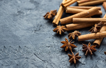 Cinnamon and anise on a dark stone table