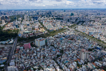 Top View of Building in a City - Aerial view Skyscrapers flying by drone of Ho Chi Mi City with development buildings, transportation, energy power 