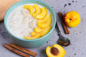 Oatmeal with milk and a peach or nectarine and cinnamon