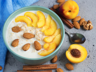 Oatmeal with almonds, honey, nectarine . Fruit and healthy Breakfast