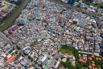 Top View of Building in a City - Aerial view Skyscrapers flying by drone of Ho Chi Mi City with development buildings, transportation, energy power 