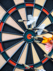 Picture of Darts arrow hitting in the target center of dartboard. concept business goal to marketing success. Business target or goal success and winner concept. success and risk management.