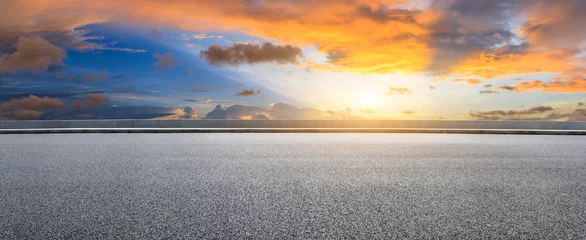 Foto op Canvas Asfaltweg en mooi wolkenlandschap bij zonsondergang © ABCDstock