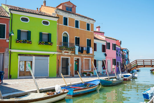 Burano island, Italy. View of a bridge and the colored houses near the canal on the island of Burano