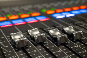 Audio Mixer with Faders pushed up on a Yamaha Mixer