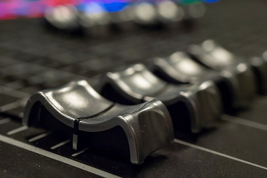 Audio Mixer with Faders pushed up on a Yamaha Mixer