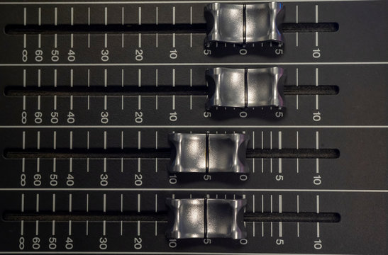 Audio Mixer with Faders pushed up on a Yamaha Mixer