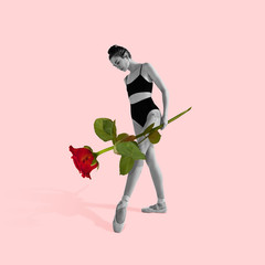 Sadness and misterious. Woman in black and white holding the big rose on pink background. Negative...