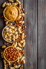 nuts in bowl for peanut butter for cooking breakfast at home on wooden background top view mock-up