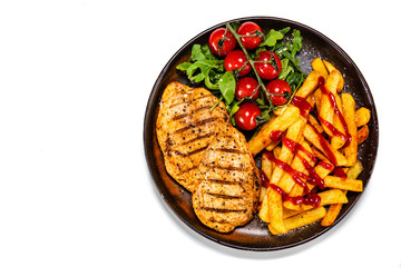 Grilled chicken fillet with french fries on white background