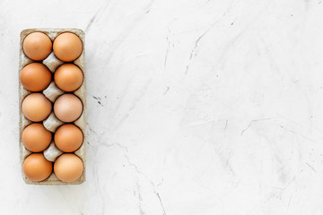 Farm products design for blog with eggs on marble background top view space for text