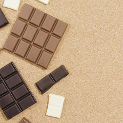 Top view chocolate frame on orange background