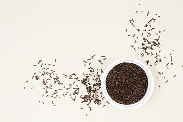 Flat lay chocolate jimmies in a bowl