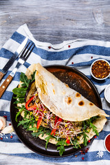 Grilled aubergine with vegetables in tortilla,