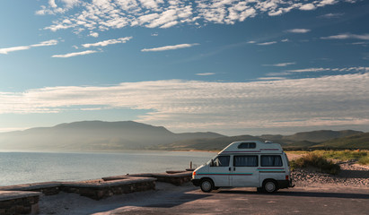 Fototapeta na wymiar Camper van parked on the beach, west coast of Ireland, wild Atlantic way