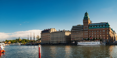 Obraz premium Buildings and ships along Nybrokajen embankment, Ostermalm district in central Stockholm, Sweden
