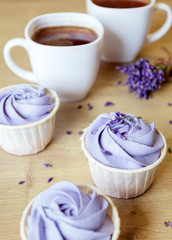 Lavender cupcakes. Desserts for birthday, weddings, holidays. Sweet purple background.