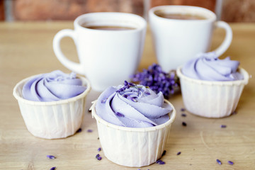 Lavender cupcakes. Desserts for birthday, weddings, holidays. Sweet purple background.
