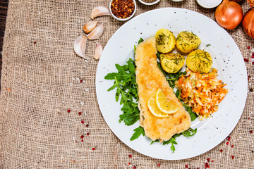 Fish dish - fried fish fillet boiled potatoes and vegetables