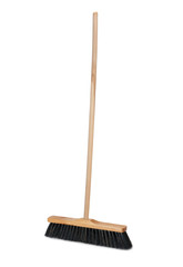 Broom with long wooden handle isolated on white background. Cleaning equipment for housework