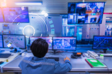 Double exposure Blurred light of man Engineering operations checking production process, Control room of a steam Turbine, Generators in the coal-fired power plant. Technology and industry concept
