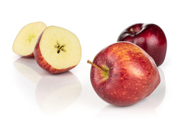 Group of two whole two halves of fresh apple red delicious isolated on white background