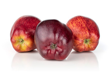 Group of three whole fresh apple red delicious the bottom is facing front isolated on white background