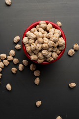 Chickpeas in the red glass on the table