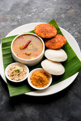 Podi idli is a quick and easy snack made with leftover idly. served with sambar and coconut chutney. selective focus