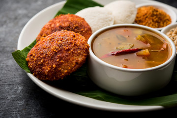 Podi idli is a quick and easy snack made with leftover idly. served with sambar and coconut chutney. selective focus