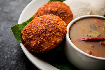 Podi idli is a quick and easy snack made with leftover idly. served with sambar and coconut chutney. selective focus