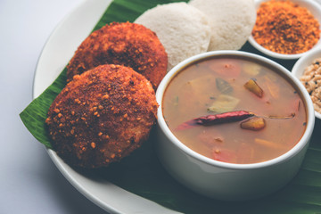 Podi idli is a quick and easy snack made with leftover idly. served with sambar and coconut chutney. selective focus