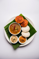 Podi idli is a quick and easy snack made with leftover idly. served with sambar and coconut chutney. selective focus