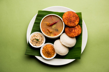 Podi idli is a quick and easy snack made with leftover idly. served with sambar and coconut chutney. selective focus