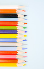  Colored pencils on a light blue background