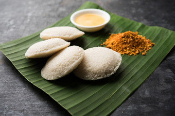 Podi idli is a quick and easy snack made with leftover idly. served with sambar and coconut chutney. selective focus