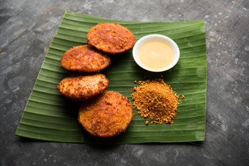 Podi idli is a quick and easy snack made with leftover idly. served with sambar and coconut chutney. selective focus