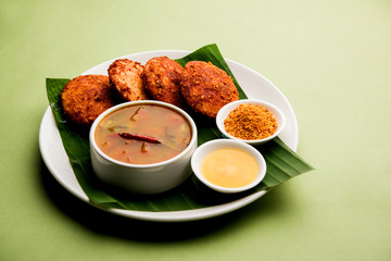 Podi idli is a quick and easy snack made with leftover idly. served with sambar and coconut chutney. selective focus
