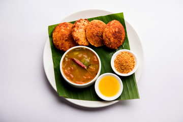 Podi idli is a quick and easy snack made with leftover idly. served with sambar and coconut chutney. selective focus