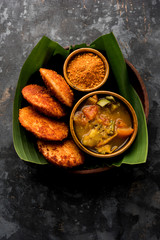 Podi idli is a quick and easy snack made with leftover idly. served with sambar and coconut chutney. selective focus