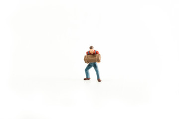 Iconic photo of a Man holding a Box/Chest, Miniature person with white isolated background