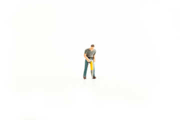 Iconic photo of a Man using a Jackhammer, Miniature person with white isolated background