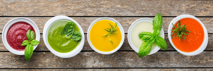Set of seasonal fall autumn creamy soups on a table