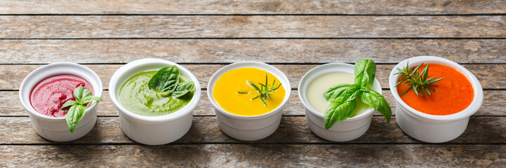 Set of seasonal fall autumn creamy soups on a table