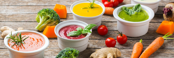 Set of seasonal fall autumn creamy soups on a table