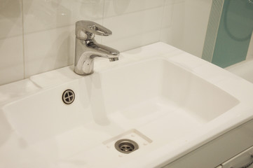 water tap. sink. bathroom.