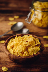 Corn flakes in a wooden bowl