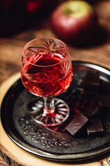 Homemade berry alcoholic beverage and chocolate