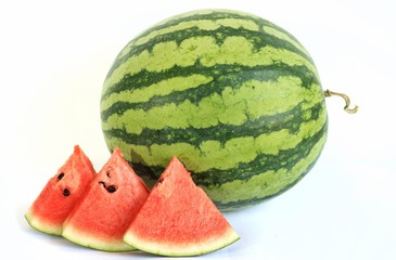 Whole of Watermelon (Citrullus lanatus) and its sliced on white background.Watermelon is very juicy,so sweet but low sugar.Have a lot of vitamins and minerals.Fruit or healthcare concept.