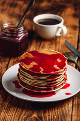 Stack of pancakes with berry fruit marmalade